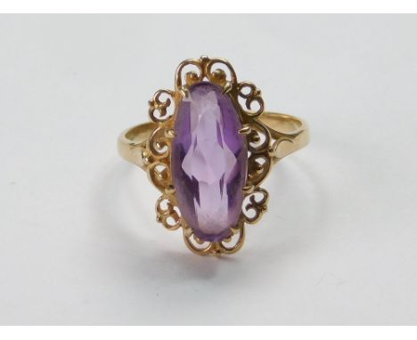 AMETHYST RING. A 9ct. gold, amethyst-set dress ring. Size M. Length of stone, 1.5cm. Approx. 2.8g. Condition Report: Good, re