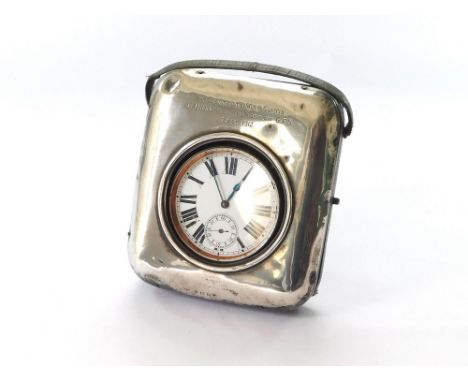 SILVER WATCH CASE. An early 20th century silver mounted watch case with strut & carrying handle. Engraved with presentation i