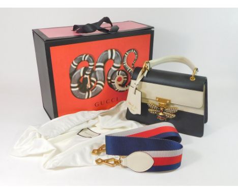 GUCCI HANDBAG. A Gucci Queen Margaret Bee calf leather handbag, featuring a gold tone, enamelled & mixed stone bee clasp. Als
