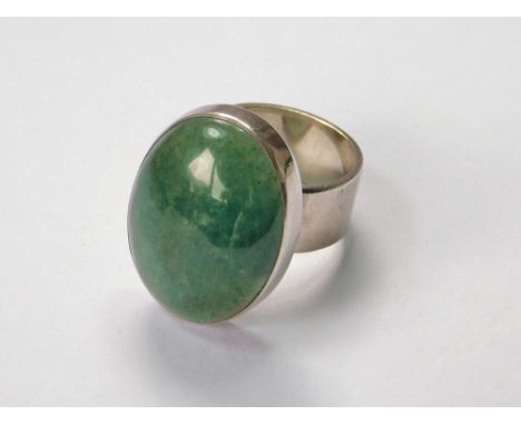 SILVER RING. A green agate dress ring, set in silver coloured metal (no hallmarks, but part maker's mark). Size T/U. Agate si