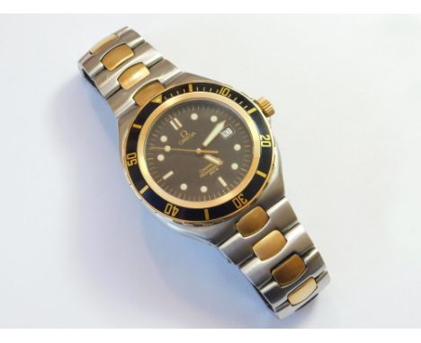 OMEGA SEAMASTER. A gentleman's Omega Seamaster Professional 200M wristwatch in stainless steel with 18k. inlays. The black di