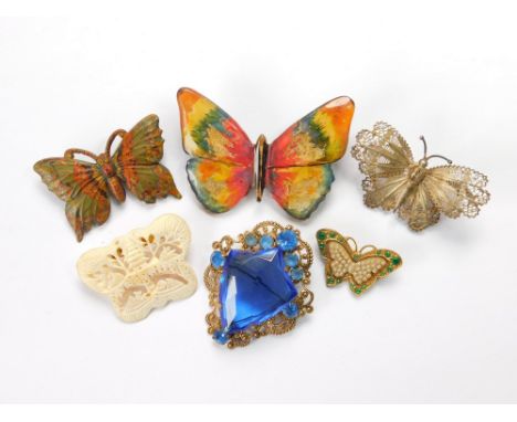 COSTUME JEWELLERY. Five various butterfly brooches in bone, silver filigree, celluloid etc. Also, a stamped brass filigree br