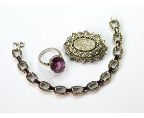 SILVER BROOCH ETC. A Victorian silver brooch with hair/photo compartment to the reverse. Width, 3.8cm. Also, a modern silver,
