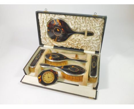 BRUSH SET ETC. An Edwardian silver & tortoiseshell, five-piece brush set, each piece with inlaid silver/gilt decoration. Fitt