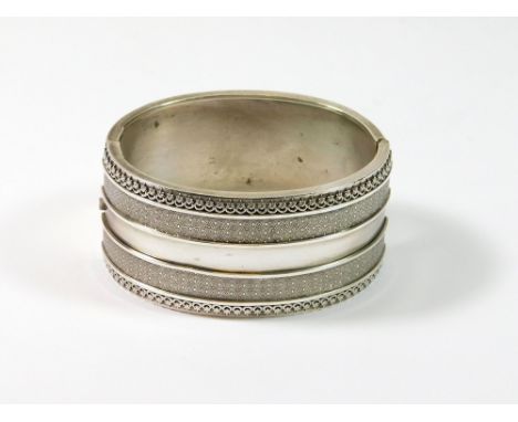 VICTORIAN BANGLE. A Victorian cuff bangle, width 3.2cm. Birmingham 1882. Condition Report: A few minor dings to the plain bac