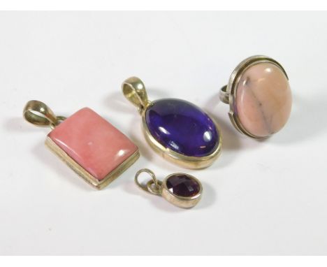 SILVER PENDANTS ETC. An oval, silver mounted amethyst pendant drop, a pink opal & silver pendant, a faceted amethyst pendant 