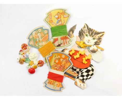 CHILDREN'S BUTTONS. A vintage greetings card/button set featuring yellow celluloid dogs. Also, three cards of 'Wilkies' yarn 