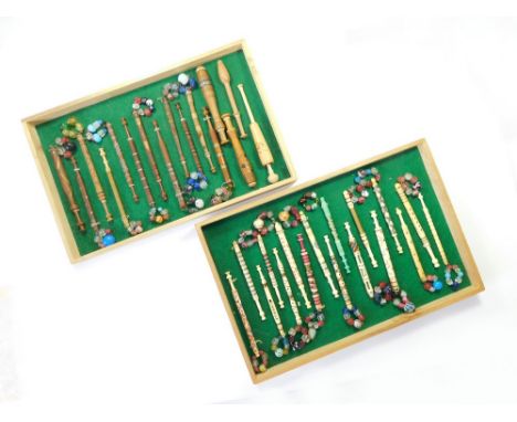 LACE BOBBINS. Two trays of lace bobbins in turned bone & turned wood. The 17 bone bobbins including a 'Mother in Babe' bobbin