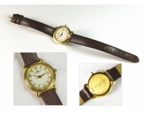 BAUME AND MERCIER. A lady's 18k-cased Baume & Mercier wristwatch, the twin coloured dial with date aperture, the crown winder