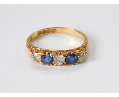 GOLD RING. An Edwardian, 18ct, gold, five stone, sapphire & diamond ring. London 1908. Size L/M. Approx. 3.1g.  Please note t