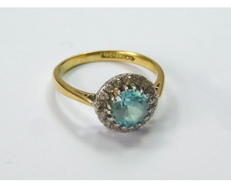 ZIRCON RING. An 18ct. gold & platinum, blue zircon & diamond cluster ring. Size Q. Approx 4.2g. Condition Report: Good. No mi