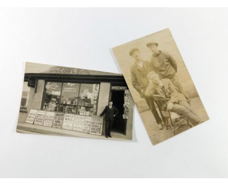 PORTHLEVEN REAL PHOTOGRAPH POSTCARDS. Two Porthleven real photograph postcards: Bert Cowls shop front & a Broad's Builders po