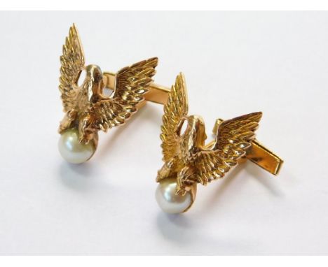 GOLD CUFFLINKS. A pair of 18ct. gold (tested) & cultured pearl 'Eagle' cufflinks. Approx. 21.67g. Note: The vendor's father s