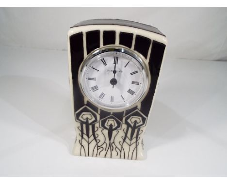 Moorcroft Pottery - a mantel clock decorated in the Peacock Parade pattern, approx 15.5 cm (high) - Est £70 - £90