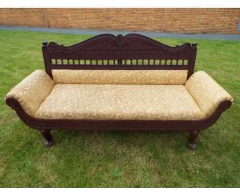 An Indian carved teakwood framed sofa diwan chair, 195 cm (width)