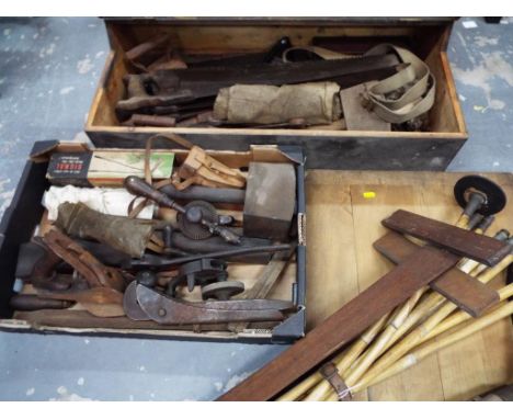 A vintage tool chest with a large quantity of vintage tools to include saws, hammers, woodworking planes, drills, drain clean
