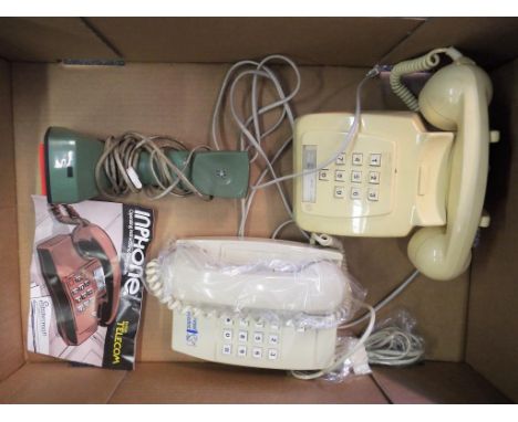 A good lot to include three vintage telephones, a BT Statesman, an Ericofon and similar