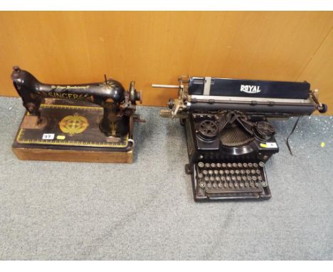 A vintage typewriter by Royal and a Singer sewing machine, Model No F8023638 (2)