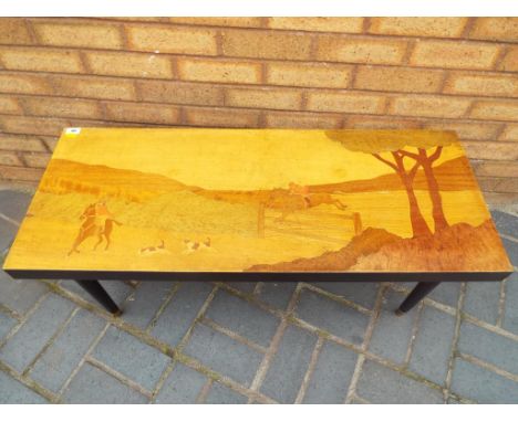 A Coffee Table depicting a hunting scene height 40 cm by 101 cm by 40 cm.