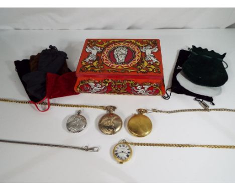 A vintage confectionery tin containing four modern pocket watches
