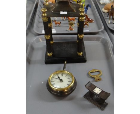 Pedestal pendulum design clock with architectural pillars. Together with a carved wooden knife rest.(B.P. 21% + VAT) 