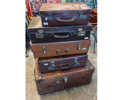 Large leather travelling trunk, two leather suitcases and two other suitcases.  (5)   (B.P. 21% + VAT) 