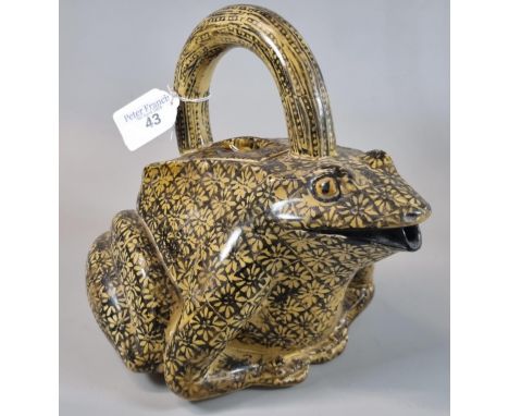 An unusual yellow glazed ceramic pouring vessel in the form of a frog/toad, overall decorated with repeating flowerheads. (B.