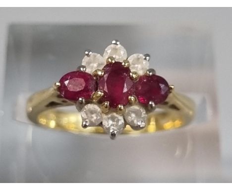 18ct gold nine stone diamond and ruby ring. 3.8g approx. Size J. (B.P. 21% + VAT)  Very, very grubby.  Stones are filthy.  No