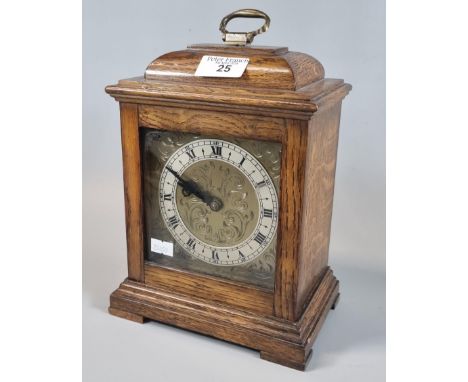 20th century oak cased mantle clock with brass face and silvered chapter ring. (B.P. 21% + VAT)  Dimensions (ie. footprint): 