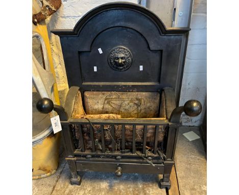 Cast Iron dog grate with arched lion mask back and fire brick lined basket with ash drawer below.  78cm high approx.   (B.P. 