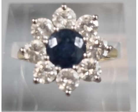 18ct gold eight stone diamond flower head ring with central sapphire stone. 5.5g approx. Size K. (B.P. 21% + VAT)  Very grubb