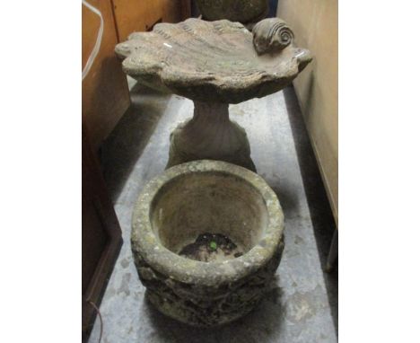 A garden stoneware bird bath in the form of a shell together with a planter decorated with birds amongst foliageLocation: 