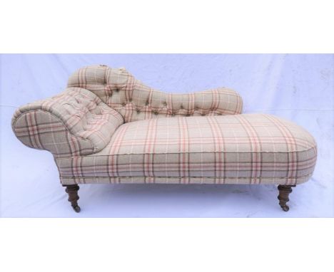 A Victorian mahogany and upholstered chaise longue, possibly by Howard & Sons, the shaped and button upholstered back flanked