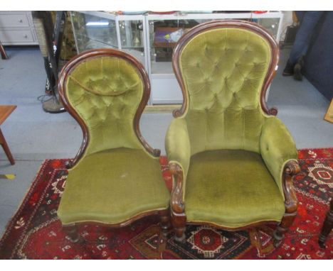 A Victorian mahogany upholstered his and her chair, upholstered in green button back fabric, on turned front legs and scrolle
