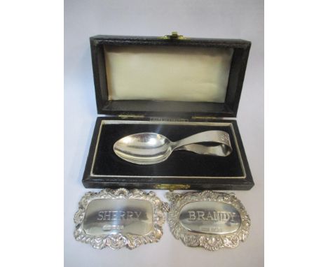 Two silver decanter labels, Sherry and Brandy and a silver child's spoonLocation: 