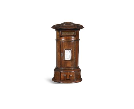 A MAHOGANY AND BRASS MOUNTED COUNTRY HOUSE LETTERBOX, the domed octagonal top with central roundel above a rectangular letter