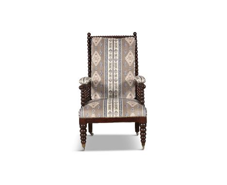 AN EARLY VICTORIAN BOBBIN-TURNED ROSEWOOD ARMCHAIR, the padded rectangular back and seat covered in an Aztec pattern fabric w