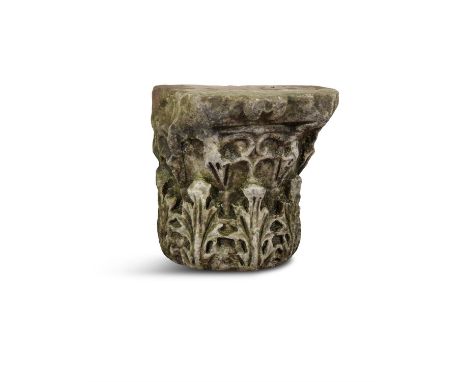 A CARVED MARBLE CORINTHIAN CAPITAL, POSSIBLY ROMAN PERIOD, with acanthus decoration adorning the front, the rear quarter unca