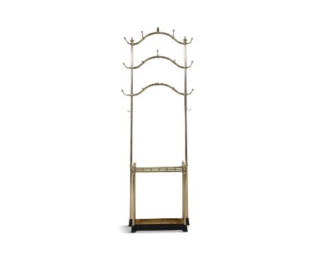 AN EDWARDIAN POLISHED BRASS TALL HAT AND COAT STAND, CIRCA 1896, raised on slender side columns above a compartmented umbrell