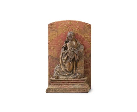 A NORTH EUROPEAN STAINED-OAK FIGURE OF THE MADONNA, POSSIBLY 17TH CENTURY, on a late silk covered stand, 21cm high, 13.5cm wi