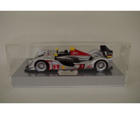 A scale model of the 2018 Le Mans winning Audi R18, in Perspex display case with plaque inscribed 'Audi Writers and Racers Di