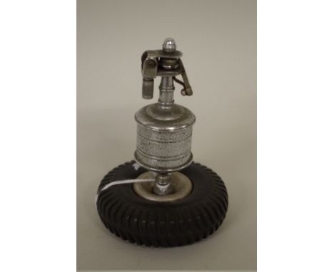 A vintage novelty Dunlop tyre table lighter, 11cm high. 