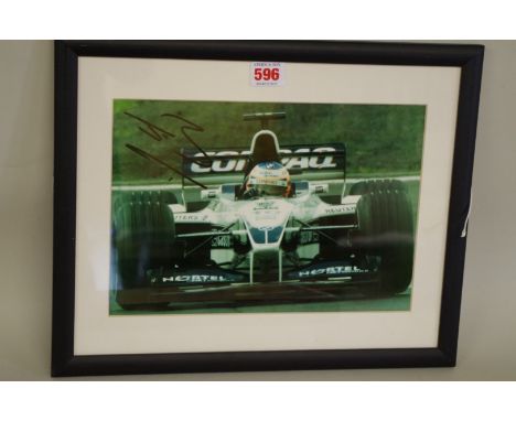 Photographs:&nbsp;a colour image of Jensen Button in BMW Williams in his British Grand Prix debut, signed, image 20 x 28.5cm.