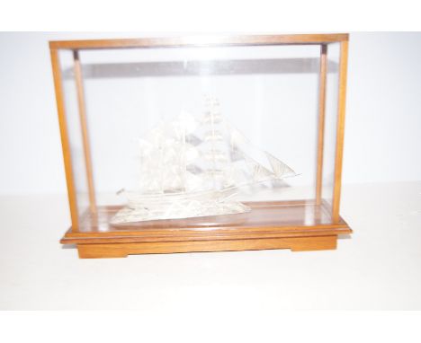 Cased Chinese and silver model of a sailboat.