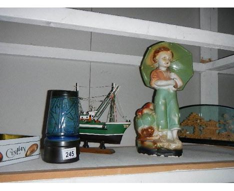 A 19/20th century chalk figure of a boy, a Celtic/Troika style pot, a cased cork display etc.,