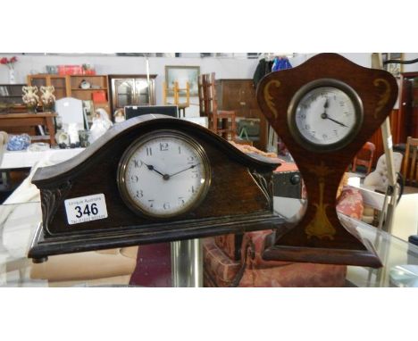 2 small wood mantel clocks, one being Napoleon hat shaped and the other lyre shaped.
