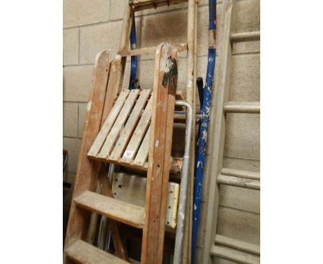 A wooden step ladder and 3 others.