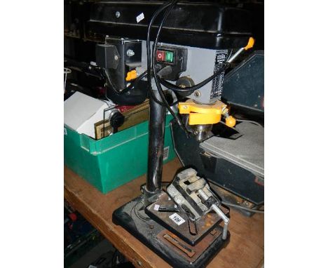 A bench drill,