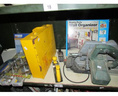 A mixed lot of tools including hand held circular saw, storage box & rack, welding electrodes, circular wire brushes etc.,