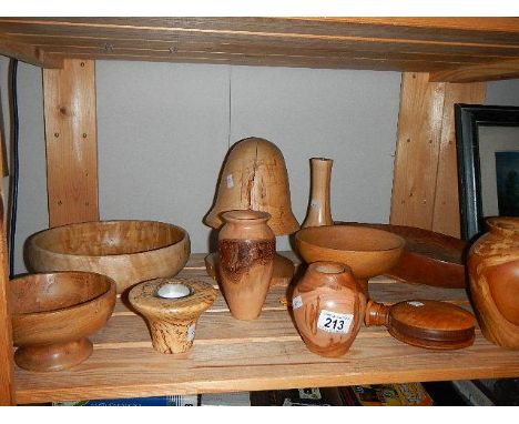 A shelf of assorted wooden items.